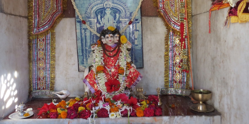 A picture of a temple's Inner Sanctum with idols of Hindu deities placed for worshipping