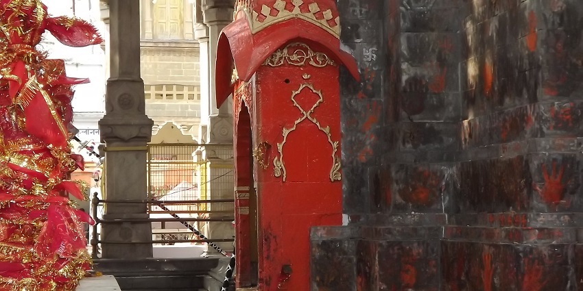 A picture of the main shrine of goddess Vajreshwari with a decorated idols at the revered temple in Maharashtra