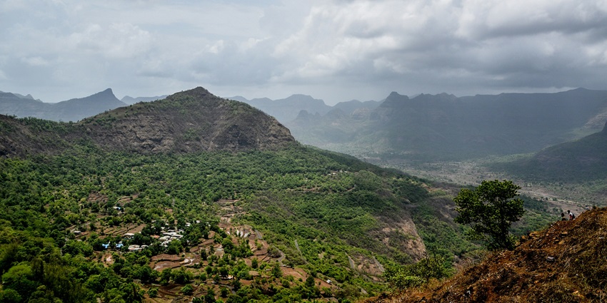 View of the clouds passing by from a viewpoint of a mountain top.