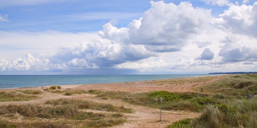 A picture of Serenity Beach, known for its tranquil vibe for relaxation and serenity.