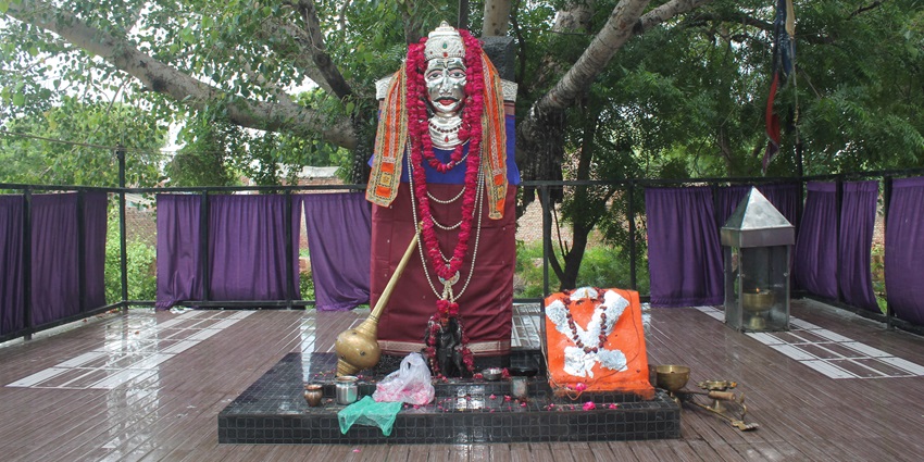 Shani Temple in Mathura features black stone deity, spiritual rituals, and devotees seeking blessings for planetary peace.