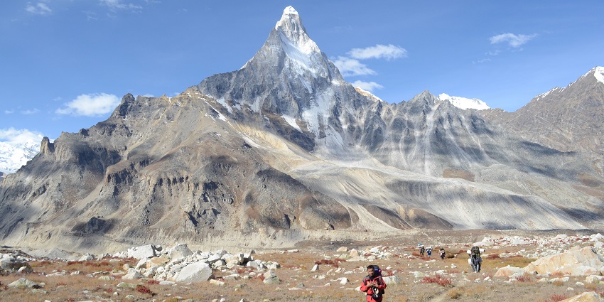 Iconic mountain peak resembling a Shiva lingam, popular among trekkers.