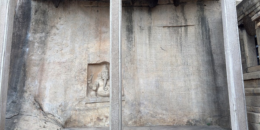 The Kudumiyanmalai inscription, located at the Sikharagiriswara Temple in Kudumiyanmalai