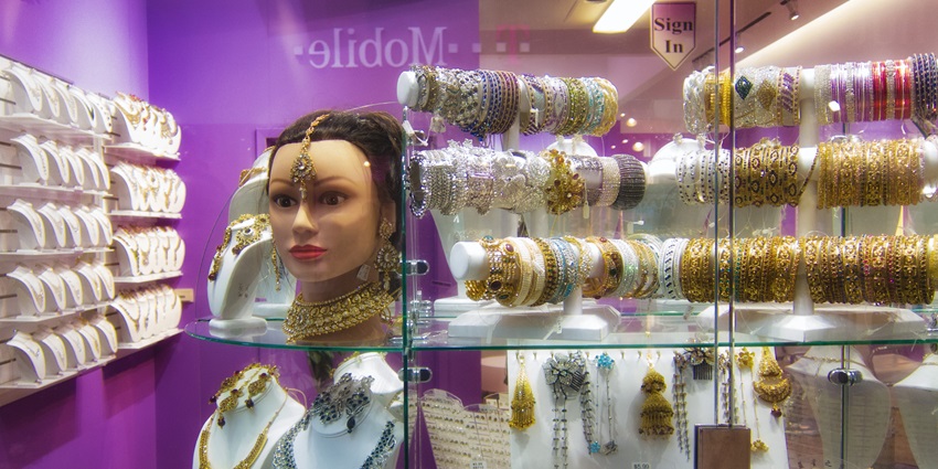 Exquisite silk saris and jewellery showcasing traditional craftsmanship.