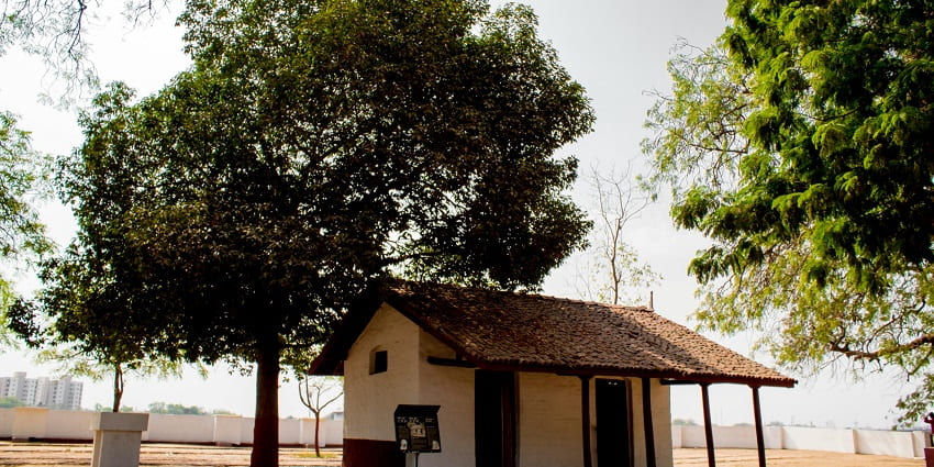 A charming white and brown house nestled in Sita Ashram, one of the top places to visit in Moradabad.
