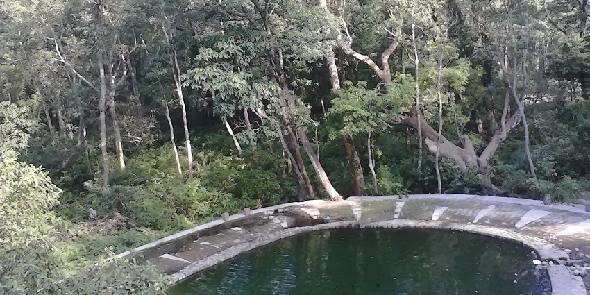 A sacred pond located in sitabani Temple with scenic views.