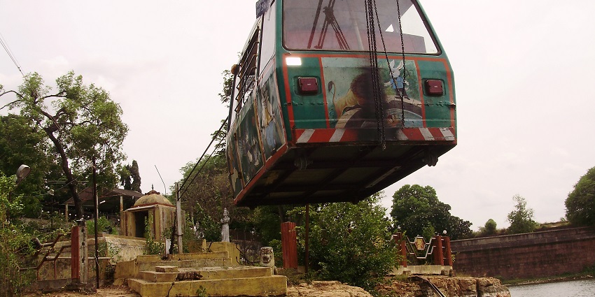Ropeway in Sivaganga Park, suspended over the lake, surrounded by the Sivaganga fort.