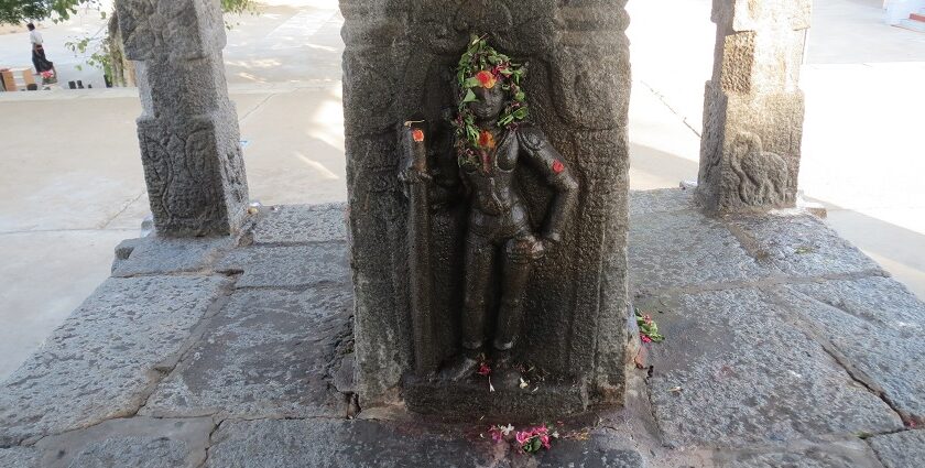 One of the many statues of god installed on a pillar, inside the Shivanmalai Temple.