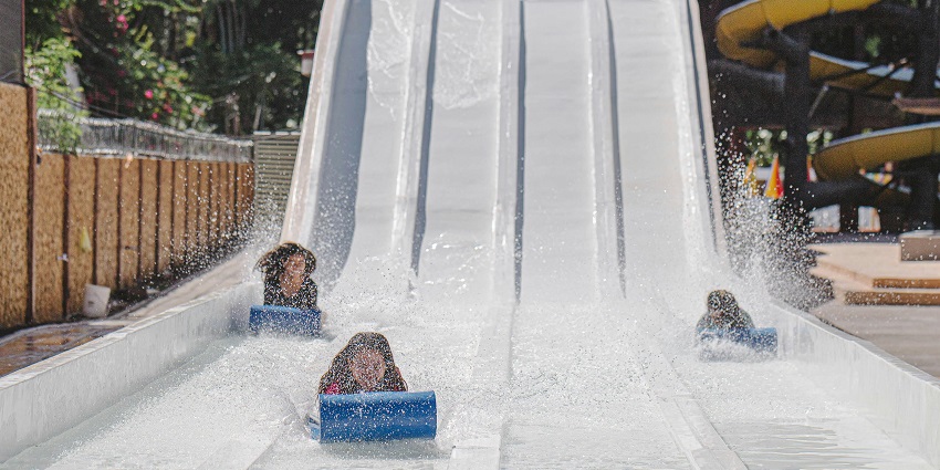 An image of white water slides in one of the Karnal water parks showcasing thrilling attractions