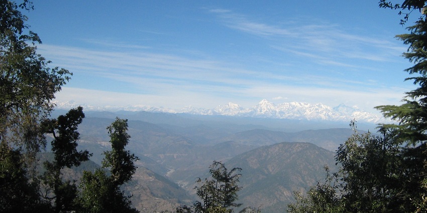 Nainital treks at Snow View Point feature breathtaking views of snow-capped mountains.