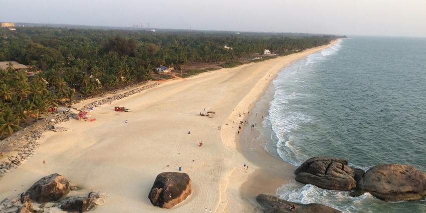 A scenic view of Sothavilai Beach featuring pristine golden sands and azure waters.