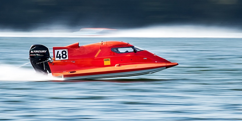 A picture of speed boating which is also one of the best Nagaon Beach water sports.