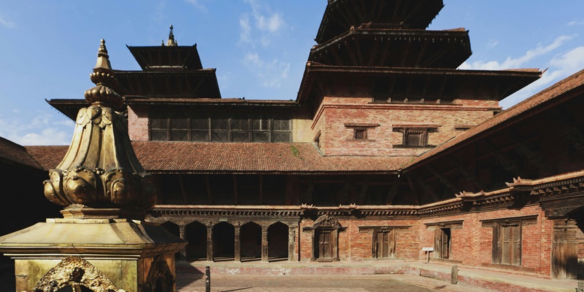 A wide-angle view of a magnificent temple with towering spires, highlighting the temple's grandeur.