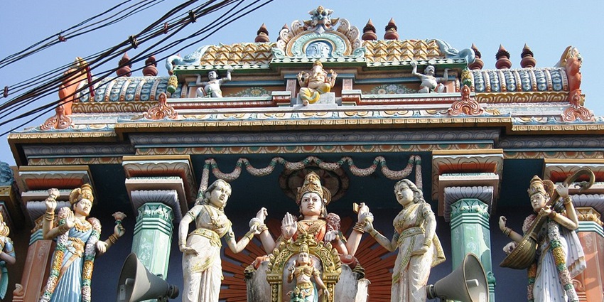 Colourful sculptures carved into the decorated entrance of Sri Kannika Parameswari Temple