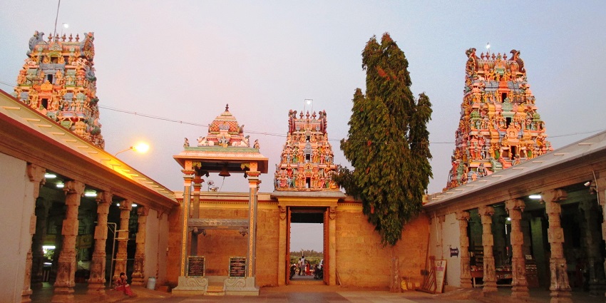 An image of towering gopurams of Sri Kottai Mariamman Temple