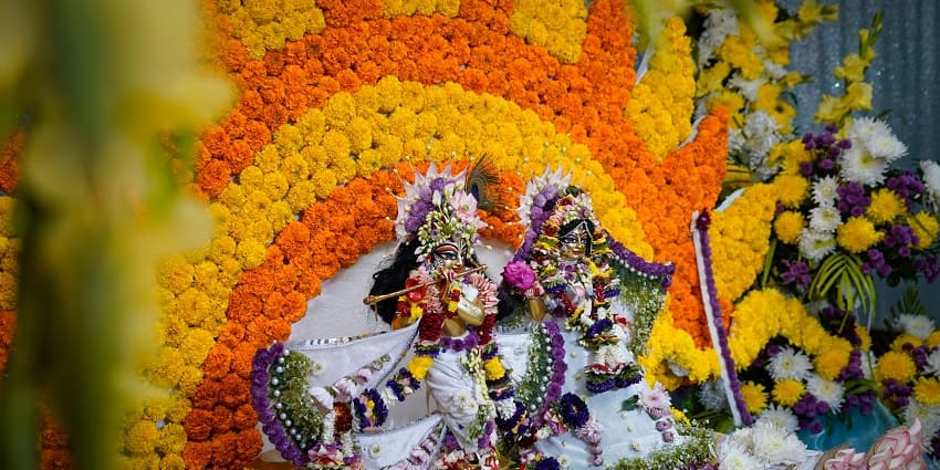 A colourful altar with statues of Krishna and Radha at a popular temple in Chennai