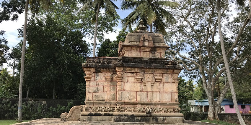 Image of an ancient temple, surrounded by greenery - famous Krishna temples in Tamil Nadu