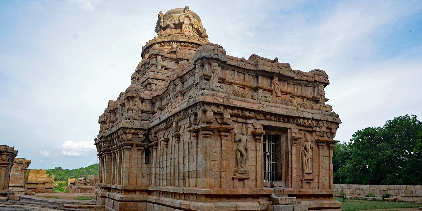 Front view of Sri Perur Pateeswarar Temple showing intensely carved tower with sculptures of deities