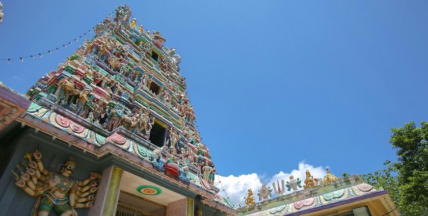 Ornate facade of Sri Prathyangira Devi Temple with colourful statues and intricate carvings