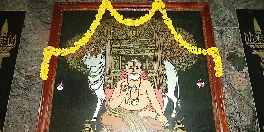 An image of Sri Raghavendra Swamy in Salem and features ornate architecture.