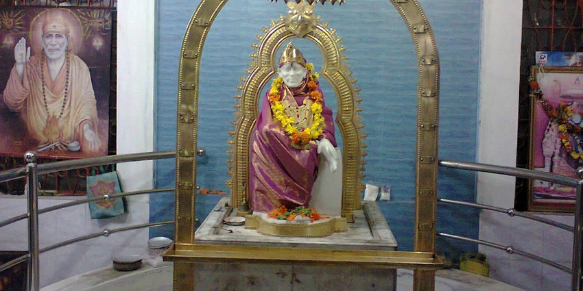 An image showing a statue of Sai Baba, featuring intricate carvings, a holy Sai Baba temple in Chennai.