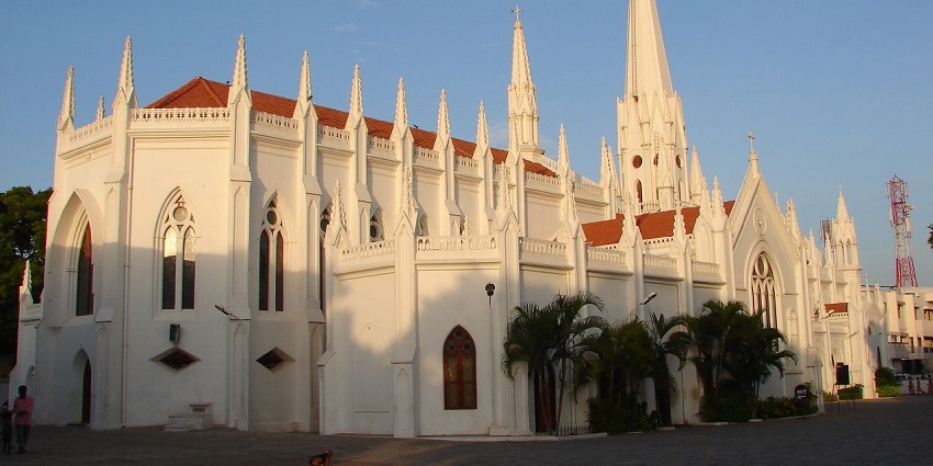 Wide angle view of the white church building , reflecting the colonial architecture