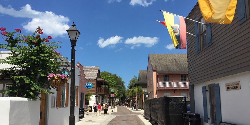 A busy street in the St. Augustine Historic District with traditional shops and people