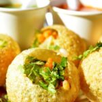 Delicious Pani Puris are filled with filling and served along the flavoured water