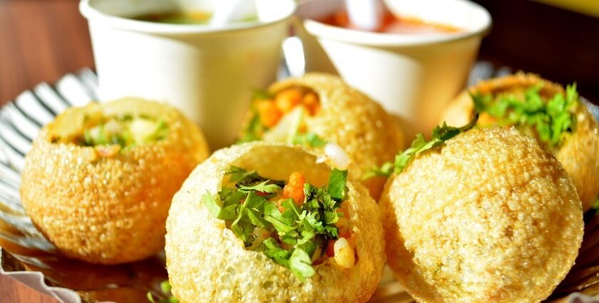 Delicious Pani Puris are filled with filling and served along the flavoured water