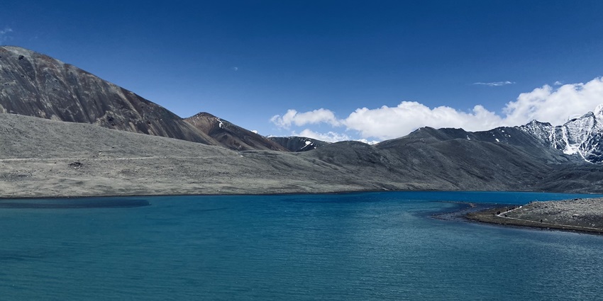 A mesmerising view of the Gurudongmar Lake flaunting its blue waters in front of the Himalayas