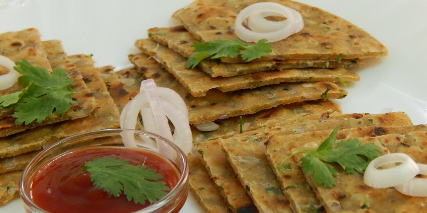 Flaky flatbreads filled with seasoned vegetables or paneer.