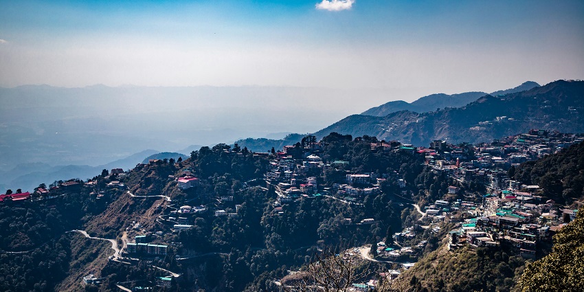An enchanting vista of towering mountains and colourful houses from the Cloud’s End.