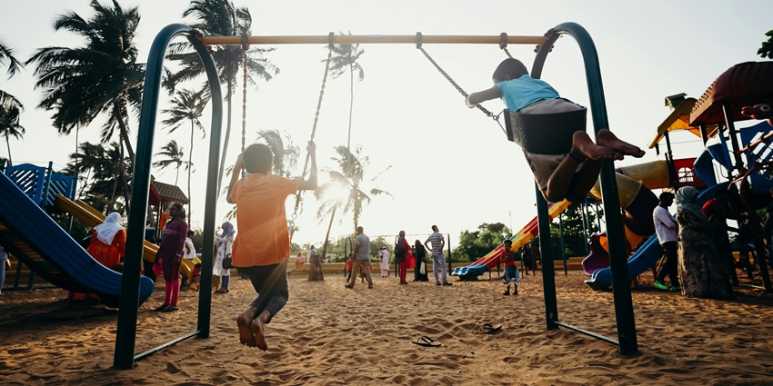 A representative image of Swarna Jayanti Park, where children play on the swing.