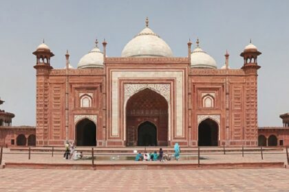 Image of picturesque Taj Mahal Mosque premises during the daytime under blue sky