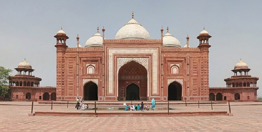 Image of picturesque Taj Mahal Mosque premises during the daytime under blue sky