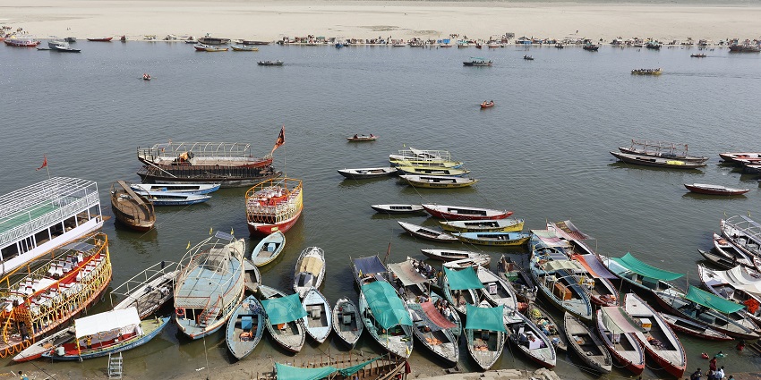 A glimpse of colourful boats decked near the azure waters at the Kushavarta Ghat.