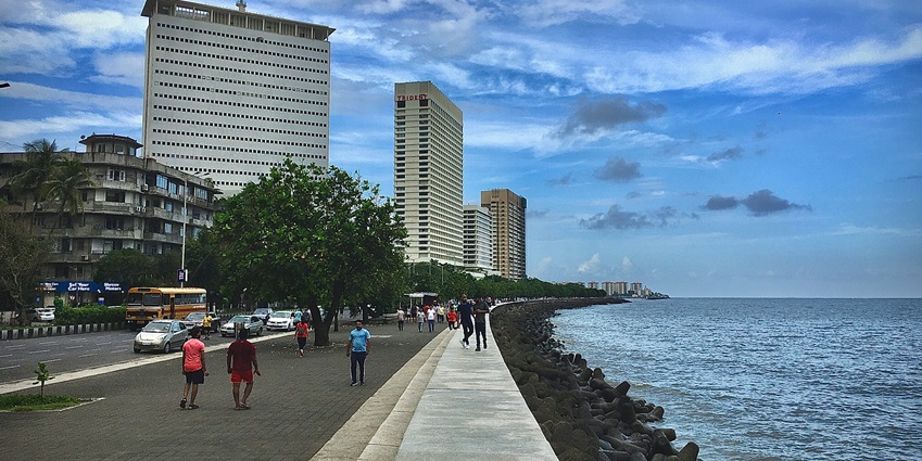 A glimpse of people enjoying a walk while exploring the iconic landmarks of Mumbai.