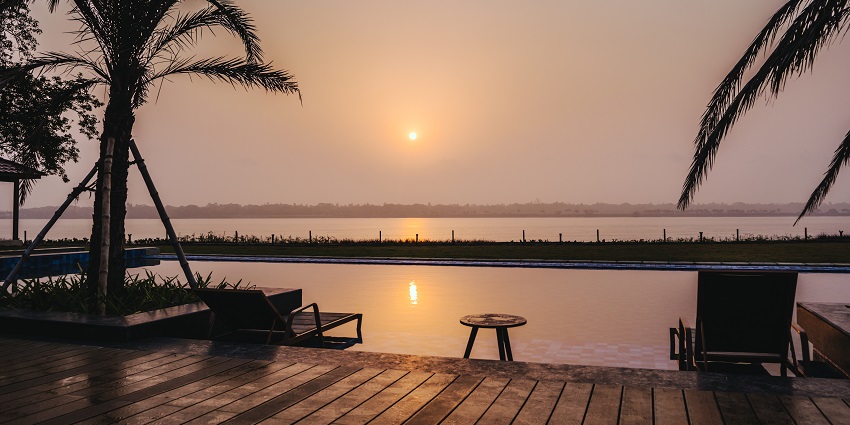 view of the sunrise sitting across a beach in the quaint town of Taki, West Bengal