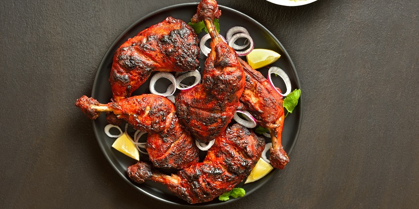 A picture of steaming hot Tandoori and Afghani chicken served in a hotel in Kanpur