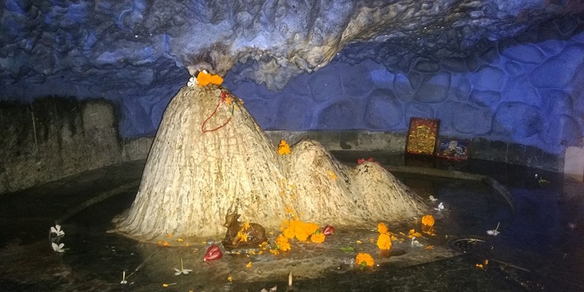 Tapkeshwar Temple, a religious place to visit near Dehradun Zoo.