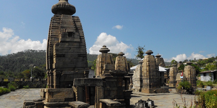 Explore Tapkeshwar Temple with sacred water flowing nearby after paragliding in Dehradun.