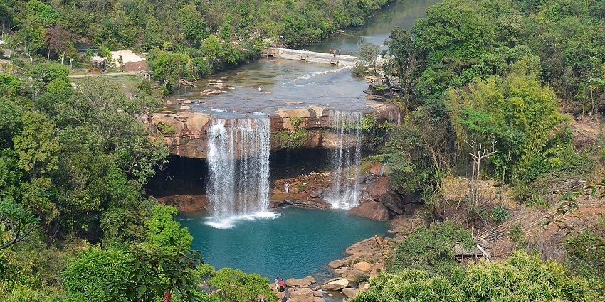 Hidden Tavli Waterfall in Ambernath cascading through rocky forest trail, popular monsoon trek with scenic jungle views, situated near Kondeshwar temple.
