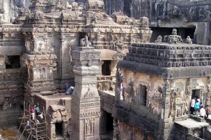 An aerial picture of a temple showing the traditional architecture and devotees worshipping