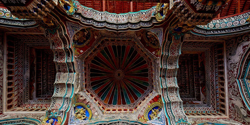 Thanjavur Palace ceiling, intricately painted with vibrant historic Dravidian-style.