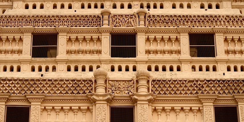 Pyramidal tower of Thanjavur Palace with intricate architectural details and balconies.