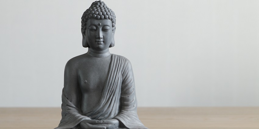 The image of a large Buddha statue, capturing a moment of devotion and spirituality.