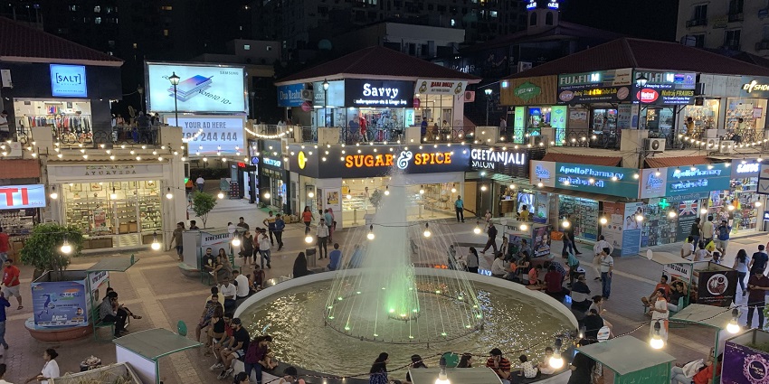 An image of a beautiful fountain and architecture at one of the best places to visit in Noida.