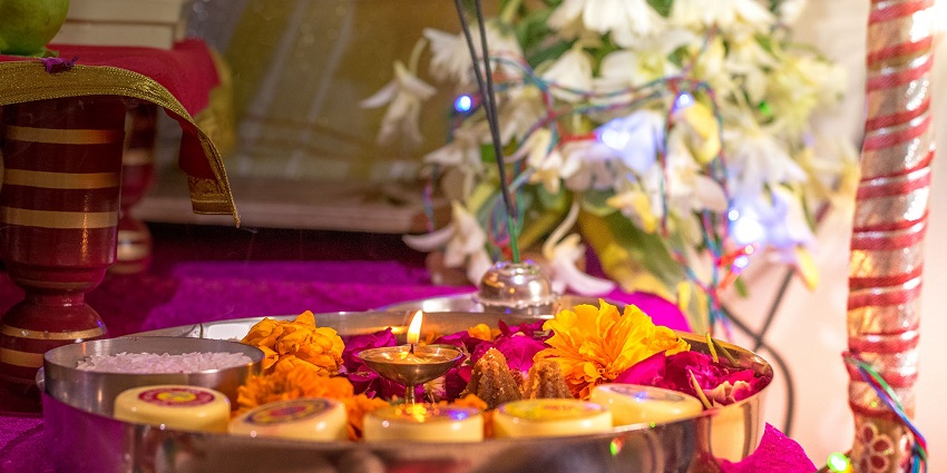 Traditional Hindu pooja thali with diya, flowers, incense - Krishna temples in Tamil Nadu