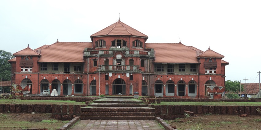 Wide angle view of the palace surrounded by a maintained garden