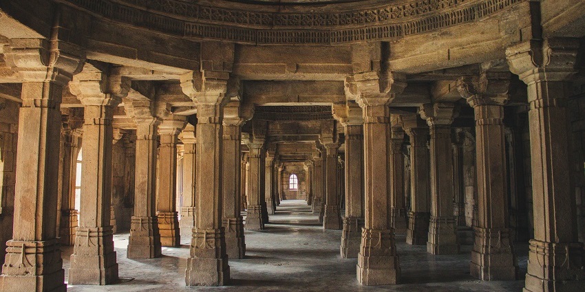 Hall in Kothandaramar temple with brownstone columns with intricate carvings and ancient architectural details. Viewers of this file can see comments and suggestions